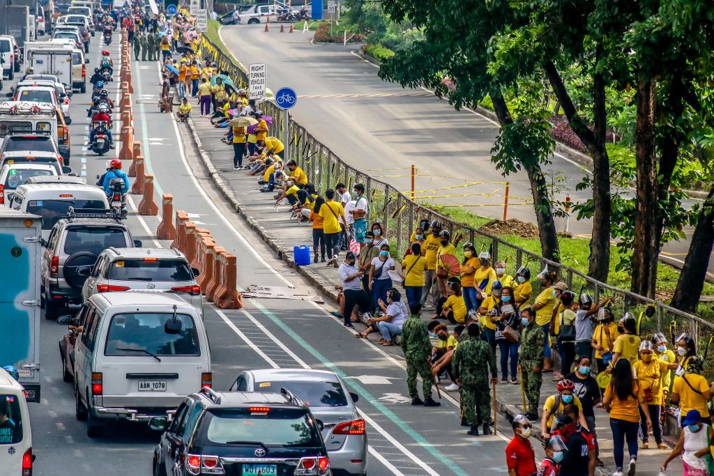 Supporters of Former President of the Philippines Benigno "Noynoy" Aquino III are waiting in line to pay their respect to his ashes brought in Ateneo De Manila University in Quezon City, Philippines on June 25, 2021. Former President Benigno Aquino III publicly known as PNoy, peacefully died last Thursday morning, June 24, 2021 at the age of 61 because of Renal Disease. (Photo by Ryan Eduard Benaid/NurPhoto via Getty Images)