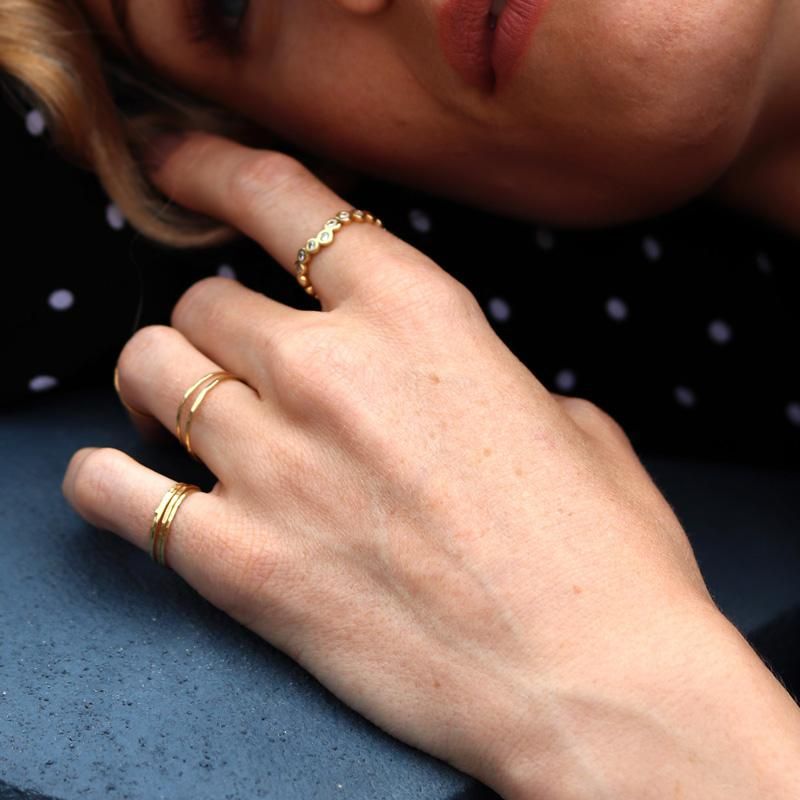 Dower & Hall 1mm Hammered Skinny Ring. | Photo: dowerandhall.com