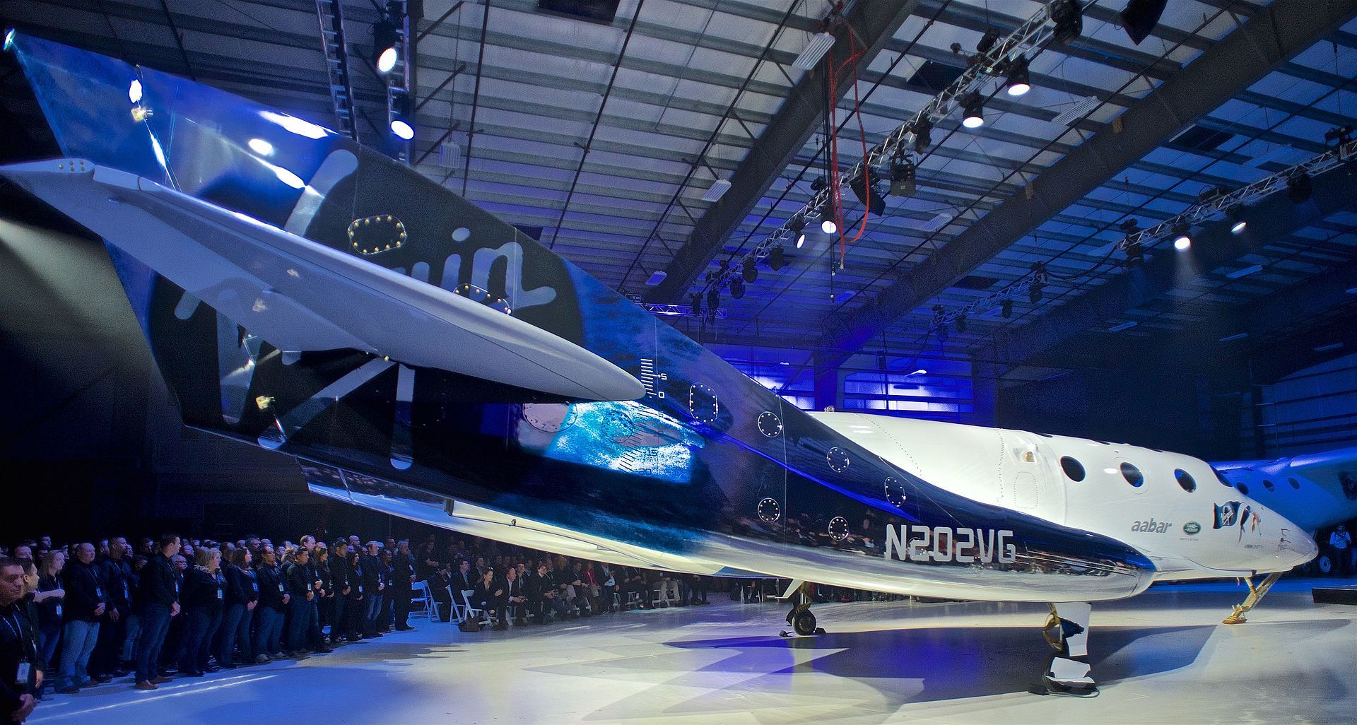 SpaceShipTwo "Unity" at rollout event on 19 February 2016 in Virgin Galactic FAITH hangar, Mojave, California, USA. | Photo from Wikimedia Commons; Ronrosano