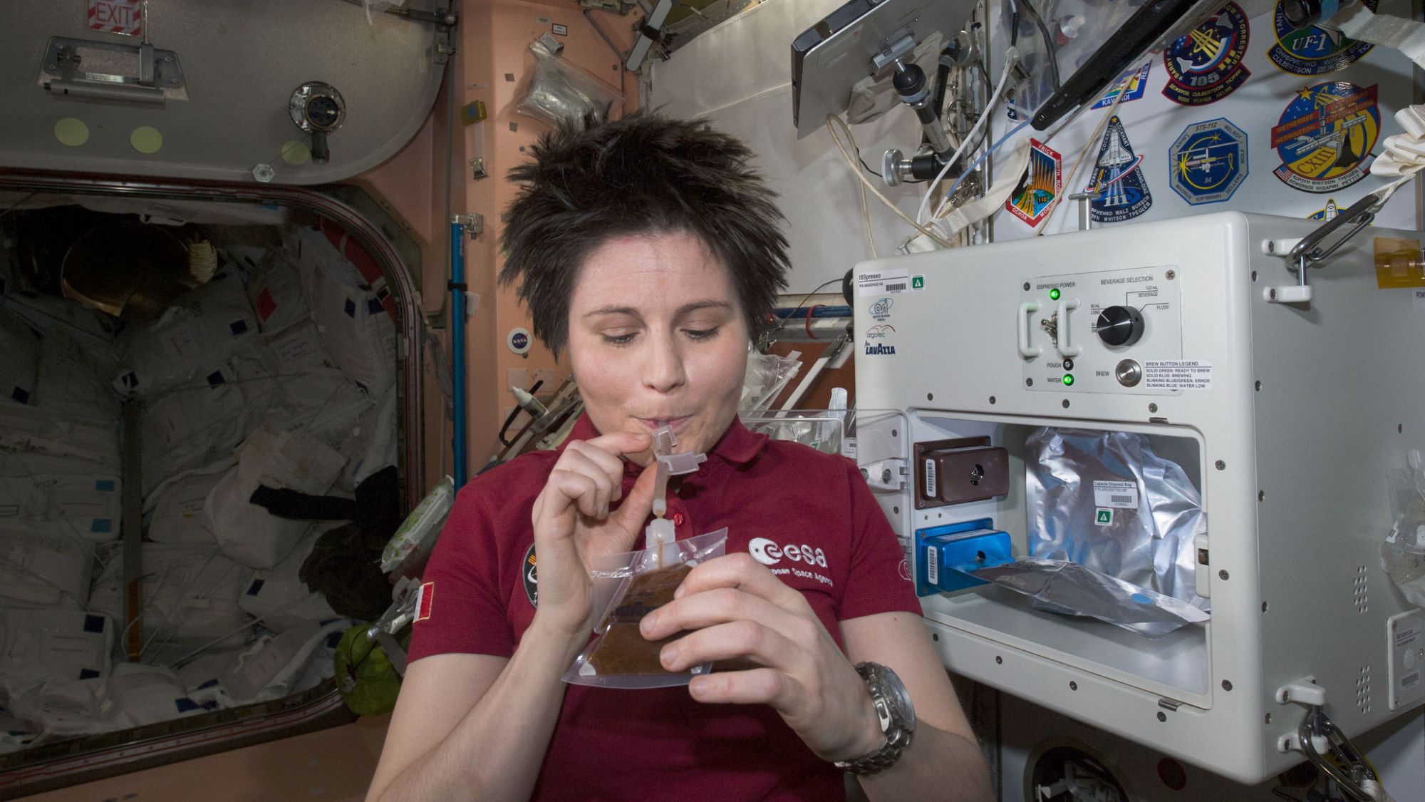 ESA (European Space Agency) astronaut Samantha Cristoforetti enjoys her first drink from the new ISSpresso machine. The espresso device allows crews to make tea, coffee, broth, or other hot beverages they might enjoy. | Photo: NASA