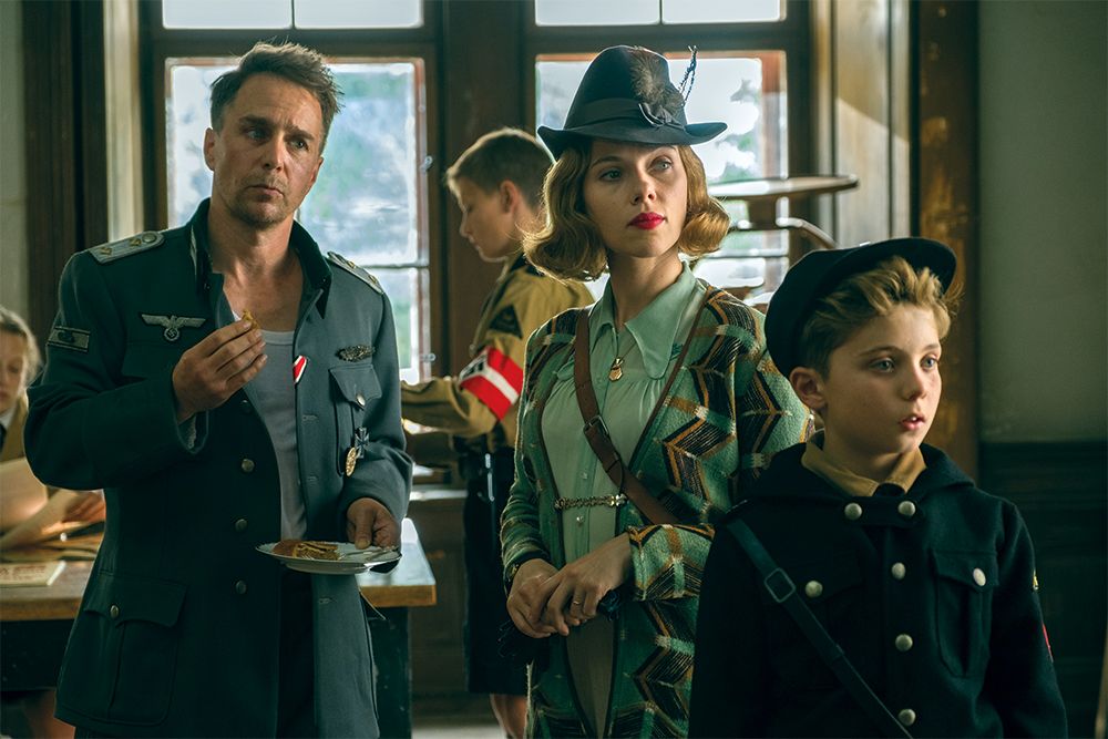 (From L-R): Sam Rockwell, Scarlett Johansson and Roman Griffin Davis in the film Jojo Rabbit | Photo by Larry Horricks; 2019 Twentieth Century Fox Film Corporation