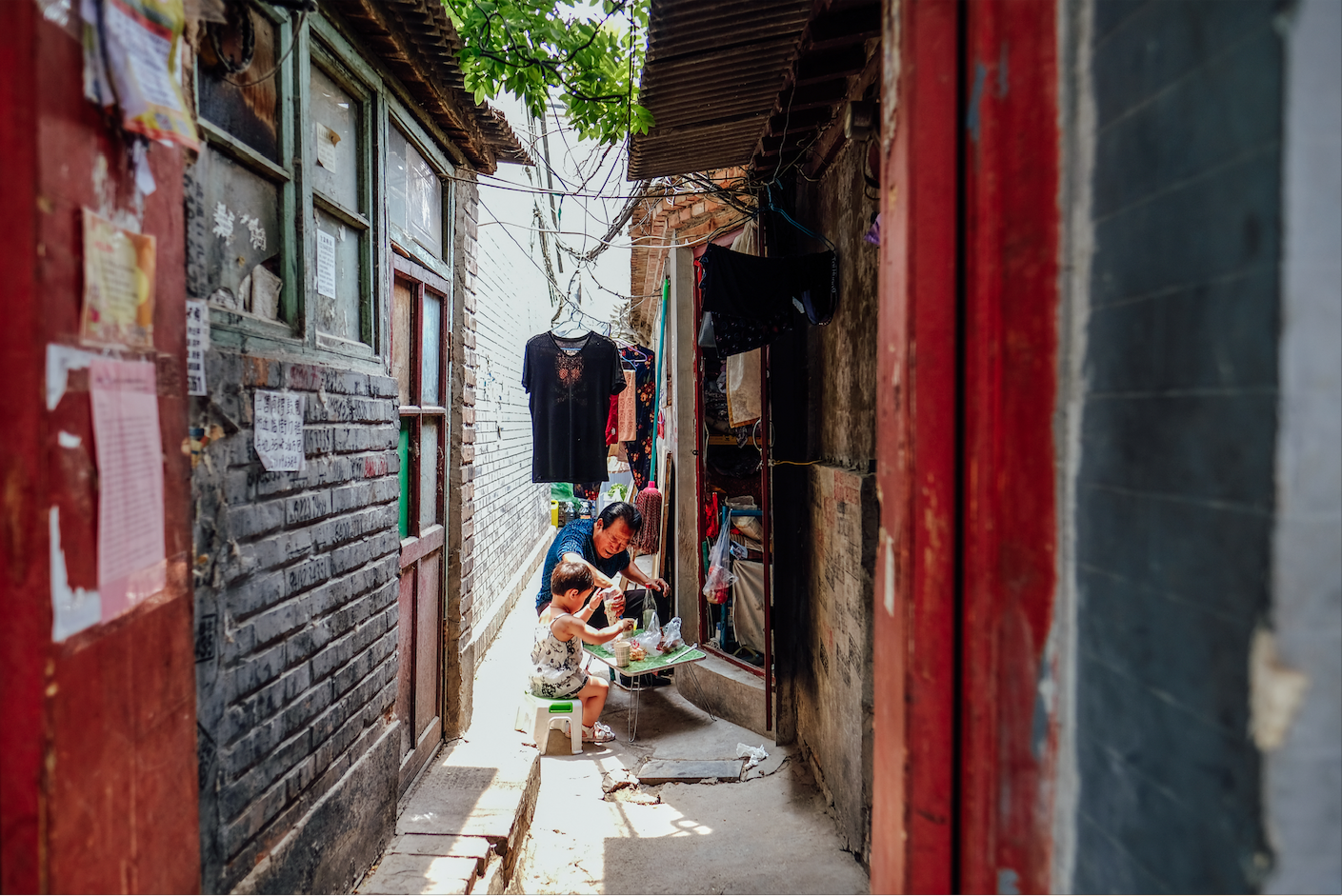 Enjoying Lunchtime with grandpa in a Hutong