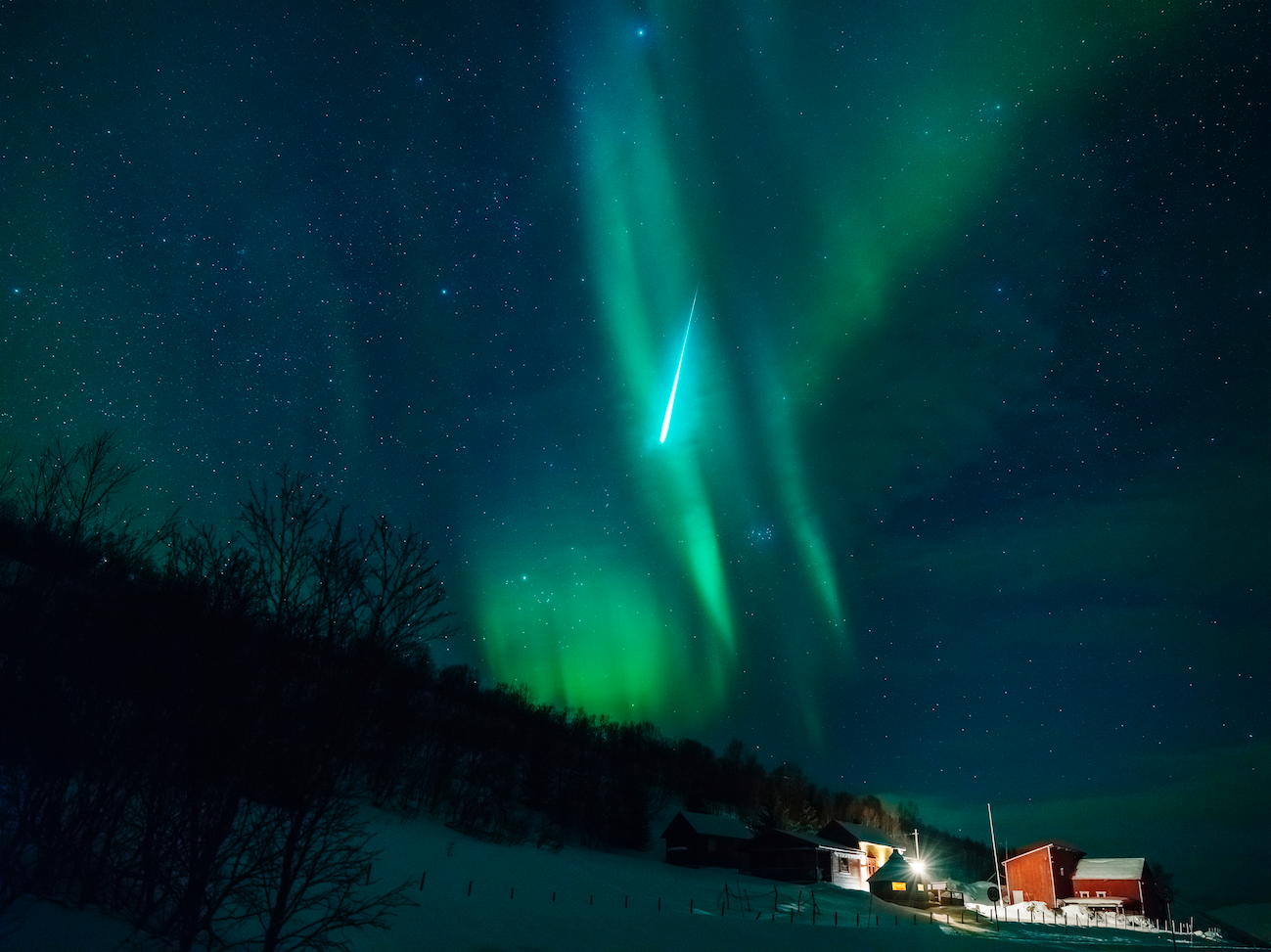 A meteorite captured in the frame with the Aurora Borealis - GFX50S by William Chua