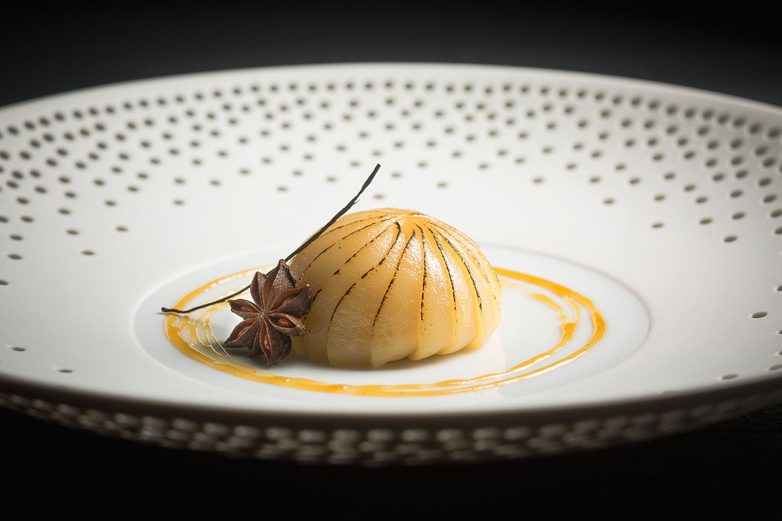 Williams pear poached in an infusion of star anise & bourbon vanilla, with light vanilla cream (Photo: Courtesy of Les Amis)