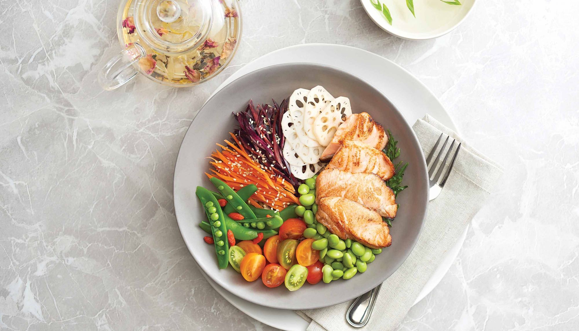 Grilled miso salmon bowl with sauteed carrots and lotus root