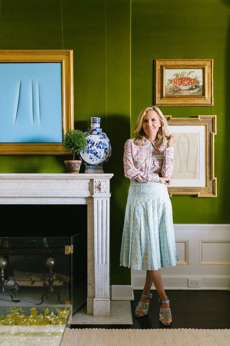 Artfully layered furnishings, each in vibrant shades of red, orange or green, sit by opulent wallpaper or deco-style monochrome walls at Tory Burch's apartment.