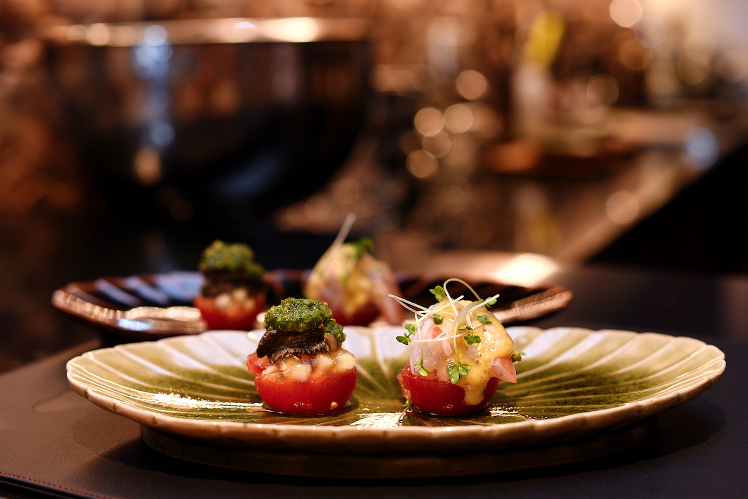 Live prawn and abalone-stuffed tomatoes