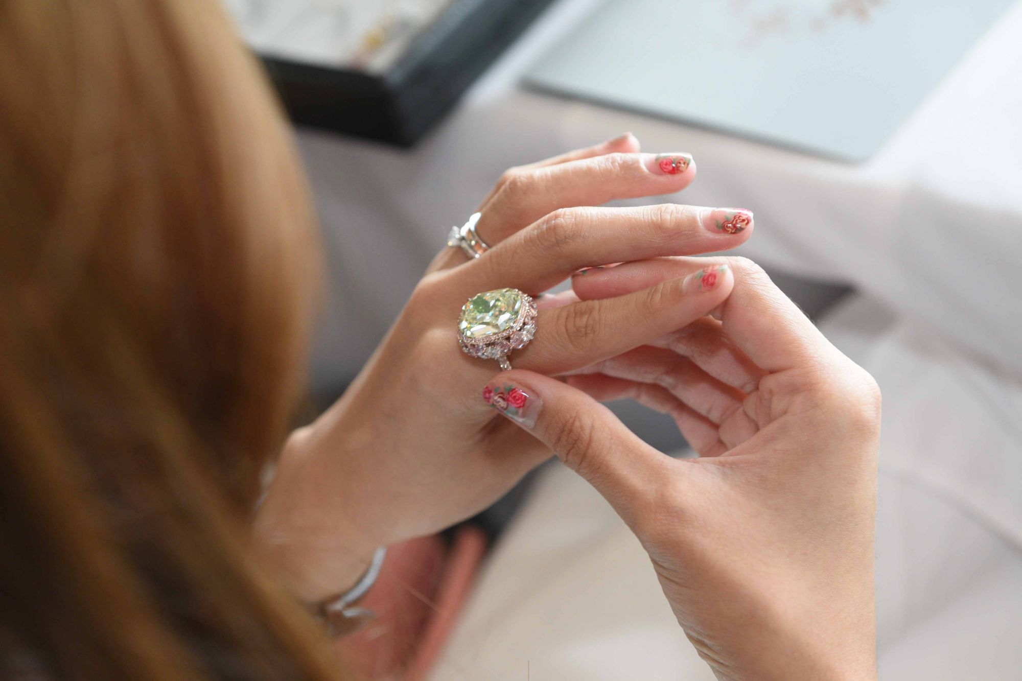 The highlight piece of the day, a 16.75-carat yellow-green diamond ring