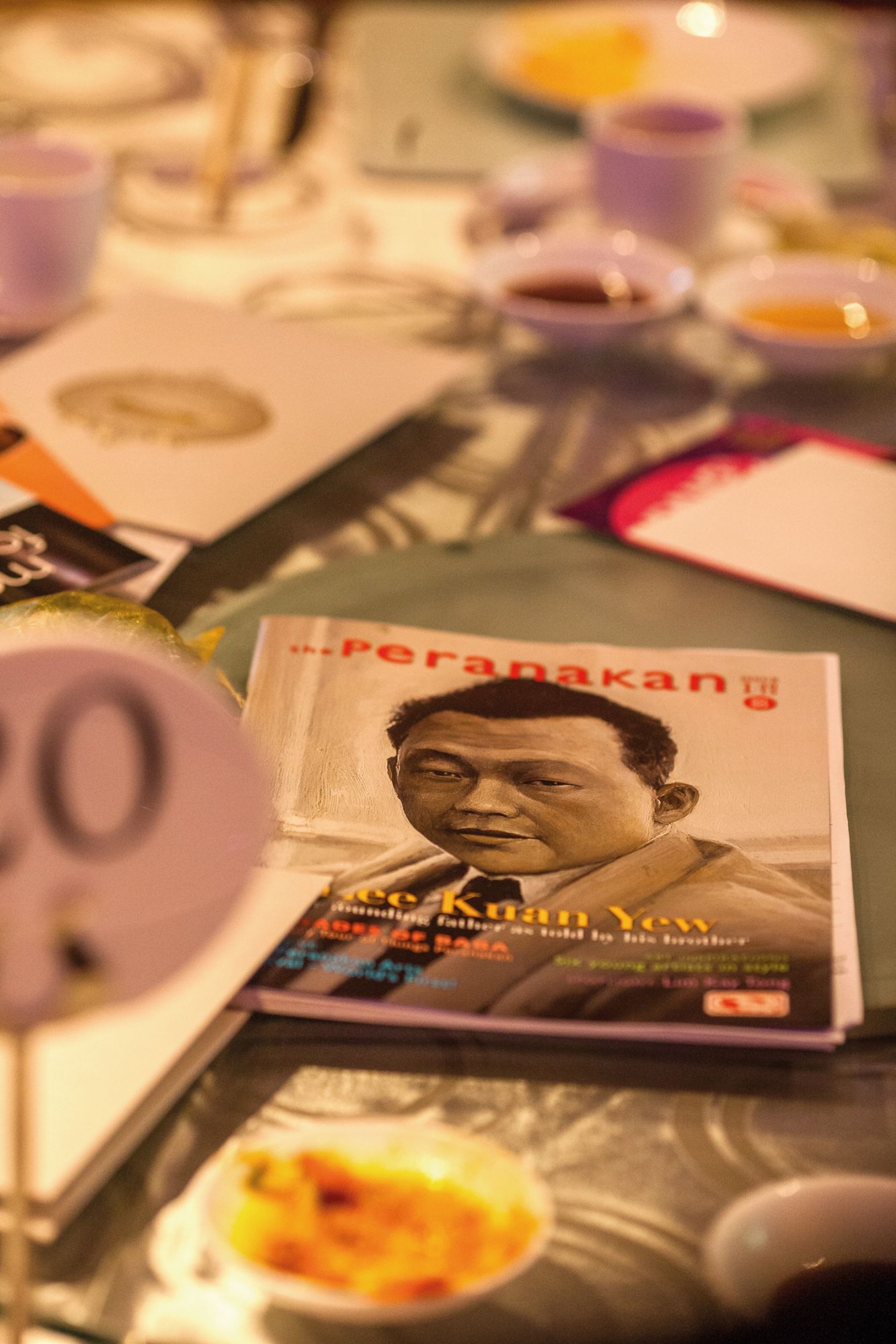 The SG50 issue of The Peranakan magazine given out that night boasted a cover story on Lee Kuan Yew, told by his brother Suan Yew. The cover is a painting by Alvin Ong