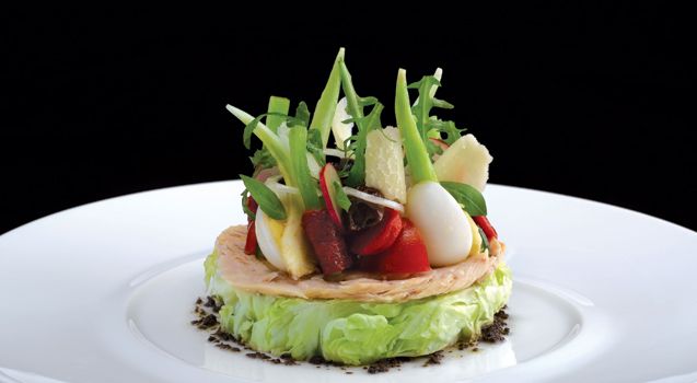 Tuna confit on a heart of lettuce garnished with thin crispy vegetables