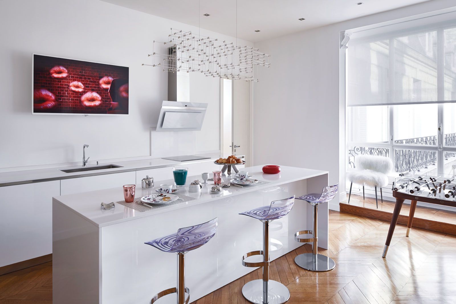 A colourful array of furniture and accessories animate the kitchen area