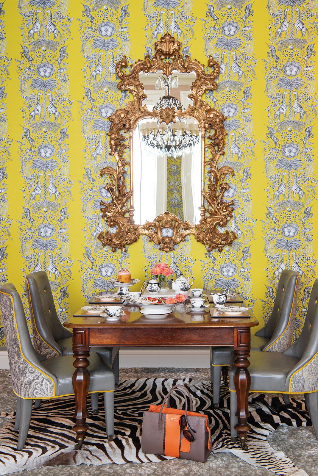 The dining chairs feature a paisley pattern that’s also applied to the curtains in the living room