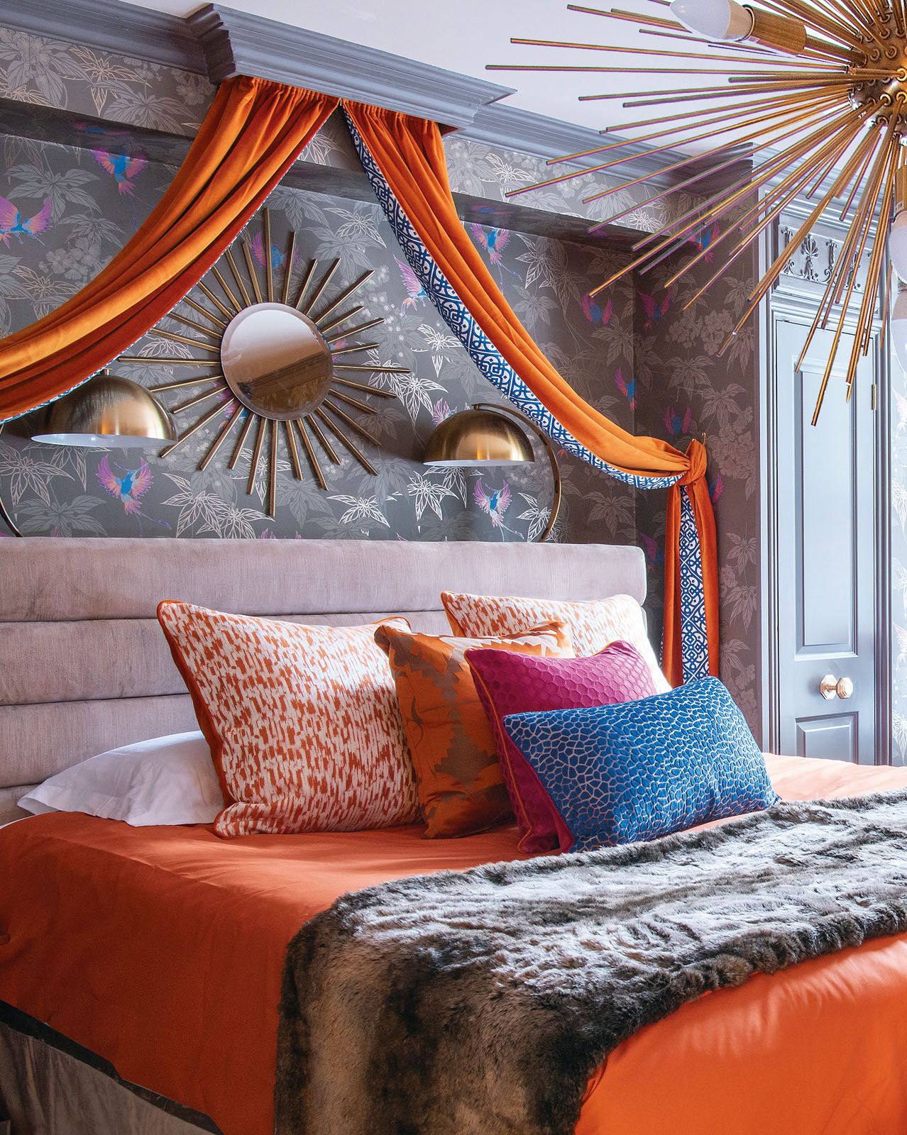 Art Deco details found in the master bedroom include the Sputnik chandelier and a sunburst mirror