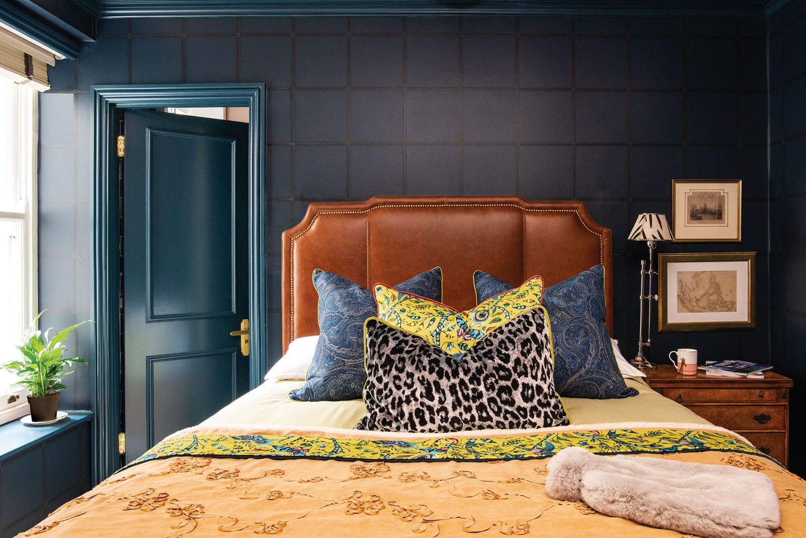 The handsome material palette of this bedroom recalls the interior of a English country house