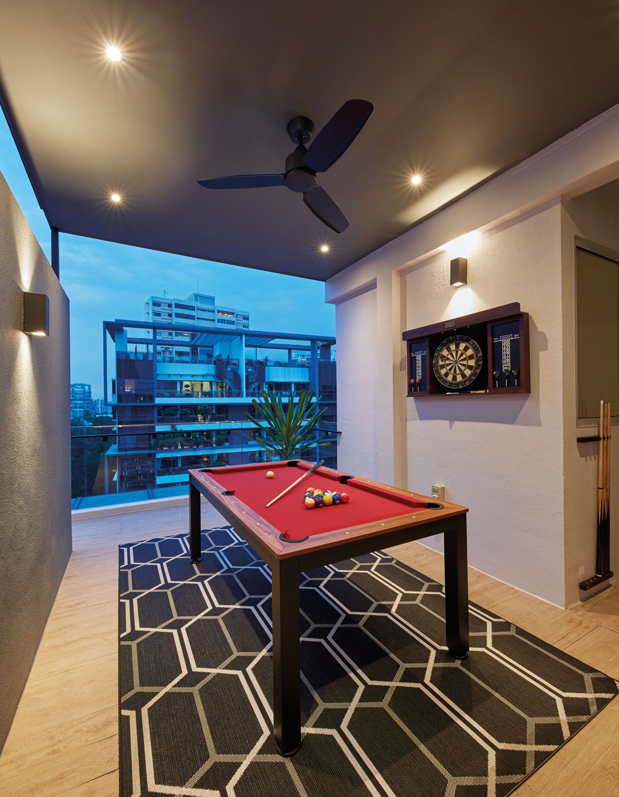 A pool table and dart board turns the outdoor mezzanine into a leisure zone