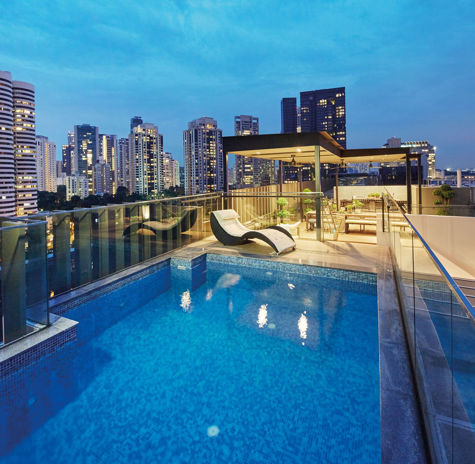 The spacious rooftop terrace features a bar, pool and ample seats for socialising