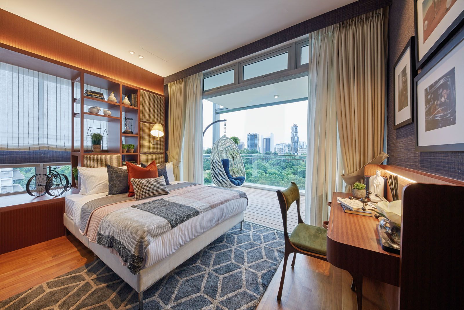 A thoughtful mix of photographic prints, potted plants and decorative objects complete the stylish tableau