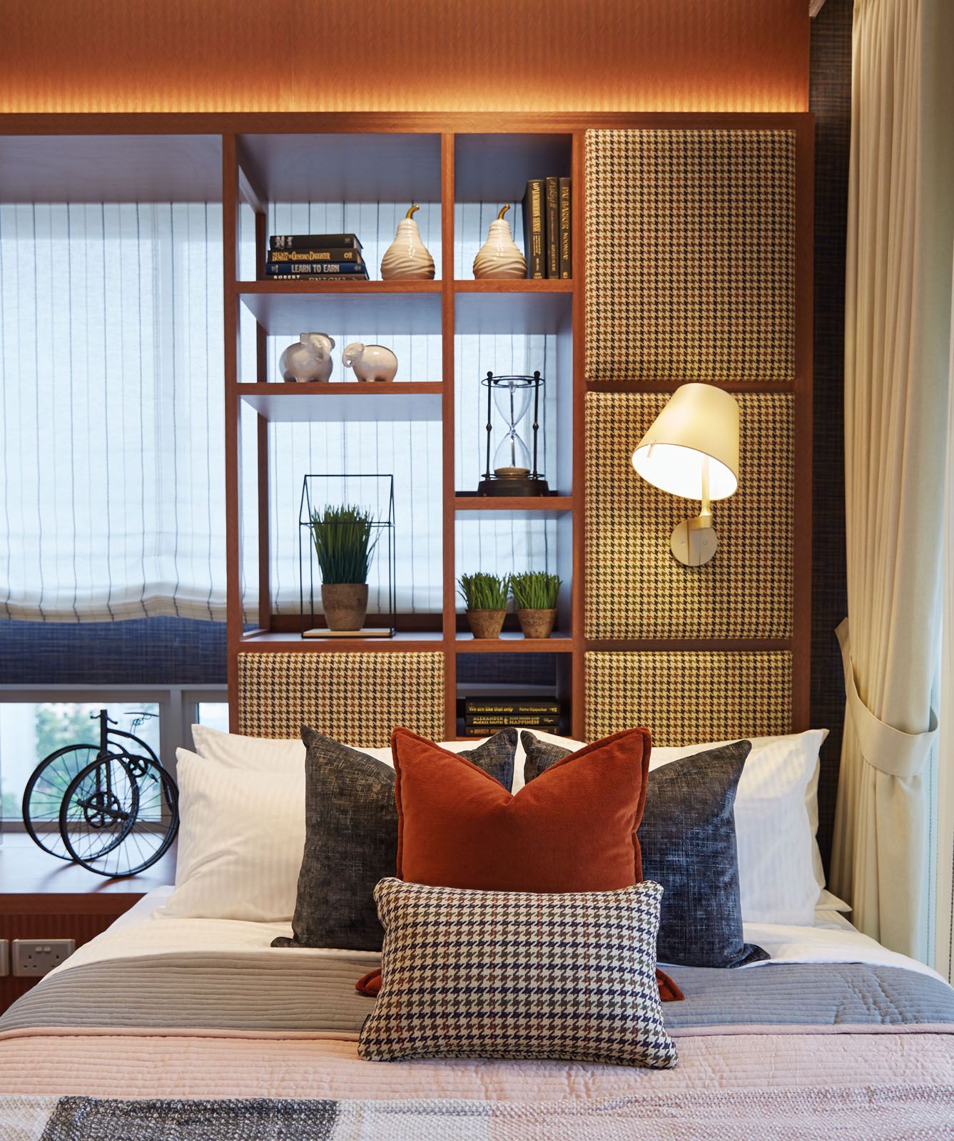 The array of patterns and colours adds a cosy touch to this bedroom