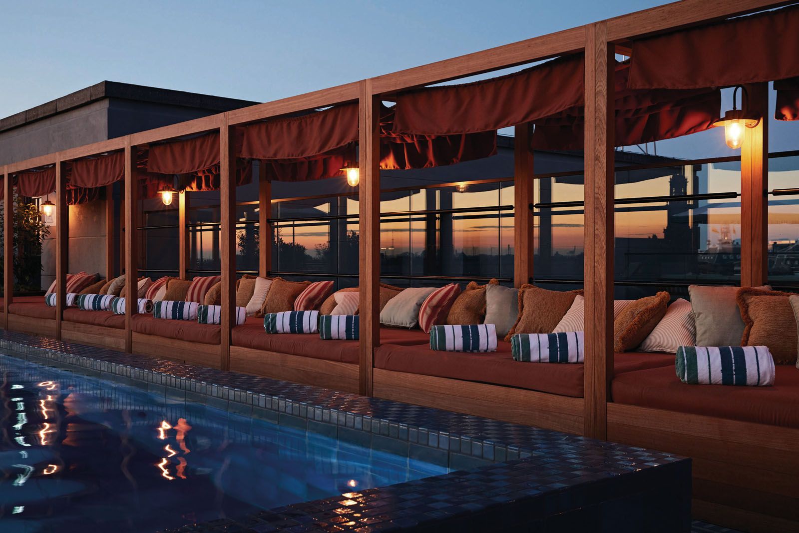The rooftop pool overlooks panoramic views of the city