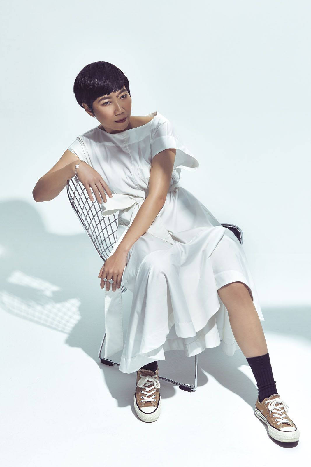 Yah-Leng wears linen-blend dress by Lee Matthews, at Club21 Four Seasons; Magic Alhambra paved diamond bracelet and ring, both by Van Cleef & Arpels; sneakers, Yah-Leng’s own