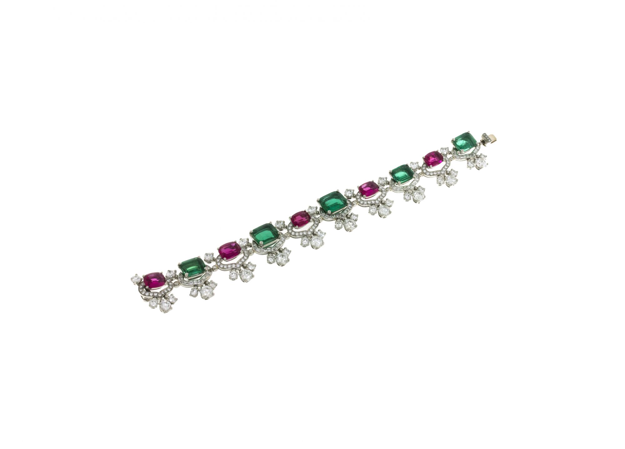 High Jewellery bracelet in white gold with 5 step cut Emeralds, 5 cushion cut Rubellites, 70 step cut Diamonds, 20 round brilliant cut Diamonds and pavé-set diamonds