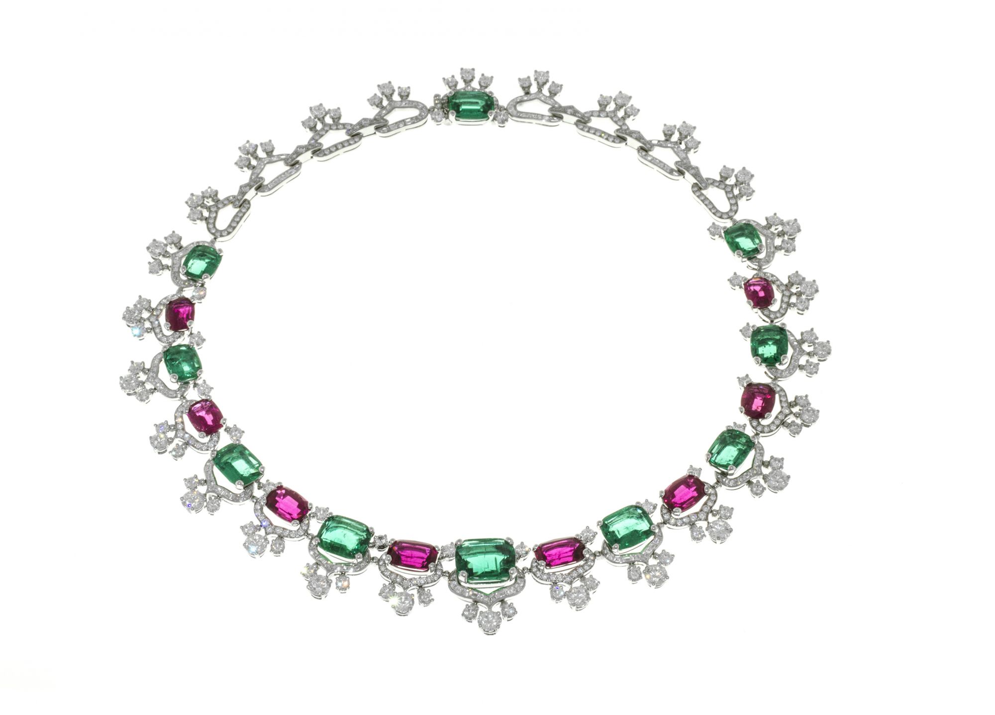 High Jewellery necklace in platinum with 10 antique cut Emeralds, 8 cushion Rubellites, 154 step cut Diamonds, and pavé-set diamonds