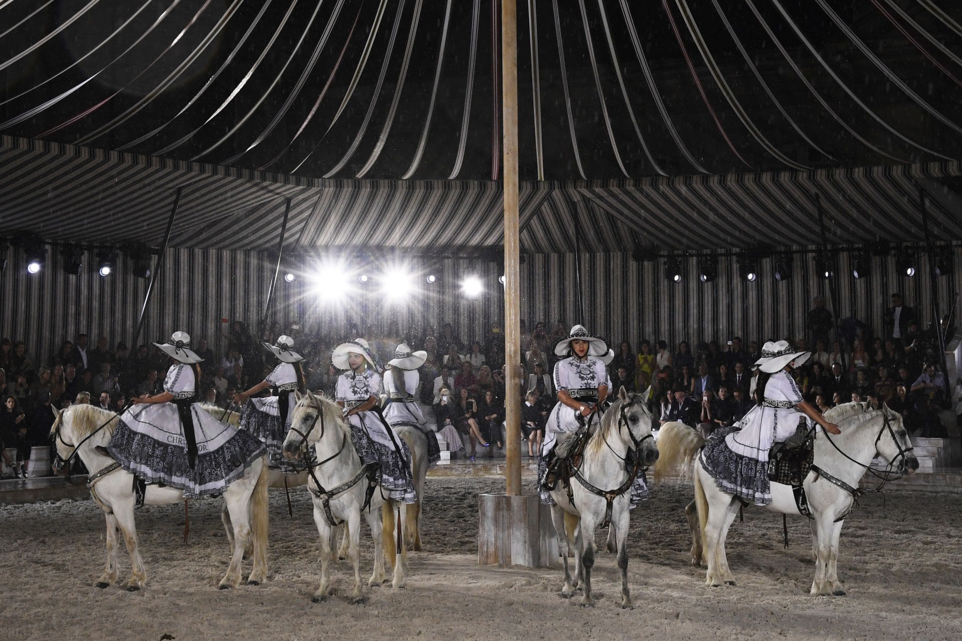 Horse-riders perform during the 2019 Dior Croisiere (Cruise) fashion show on May 25, 2018 at the Grandes Ãcuries de Chantilly, near Paris. (Photo by Bertrand GUAY / AFP)