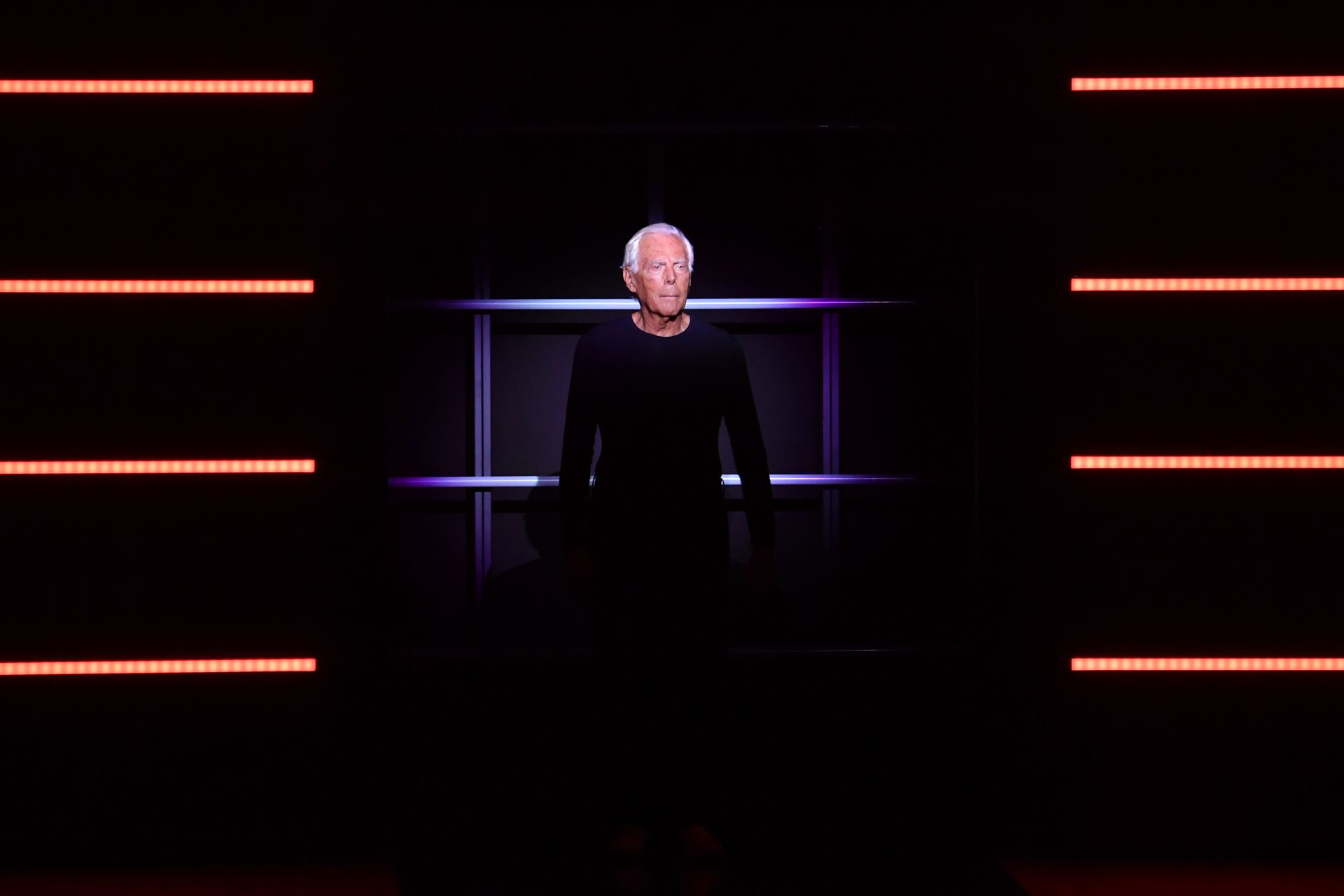 Italian fashion designer Giorgio Armani acknowledges applause following the presentation of the Emporio Armani women's Fall/Winter 2019/2020 collection on February 21, 2019 in Milan. (Photo by Andreas SOLARO / AFP)