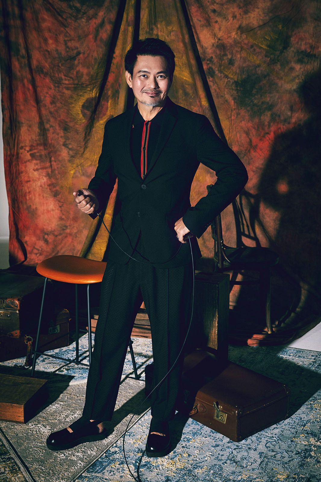 Viscose cotton jumper and wool suit, both by Fendi; shoes, Mervin’s own
