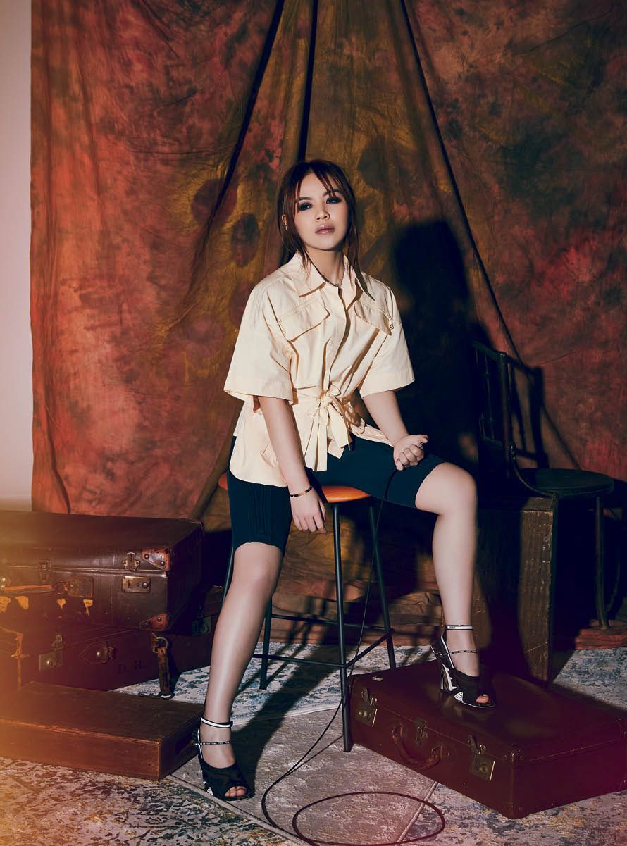 Chloe Ng wears cotton shirt, lycra shorts, crystal ear cuff and FFreedom technical mesh sandals, all by Fendi