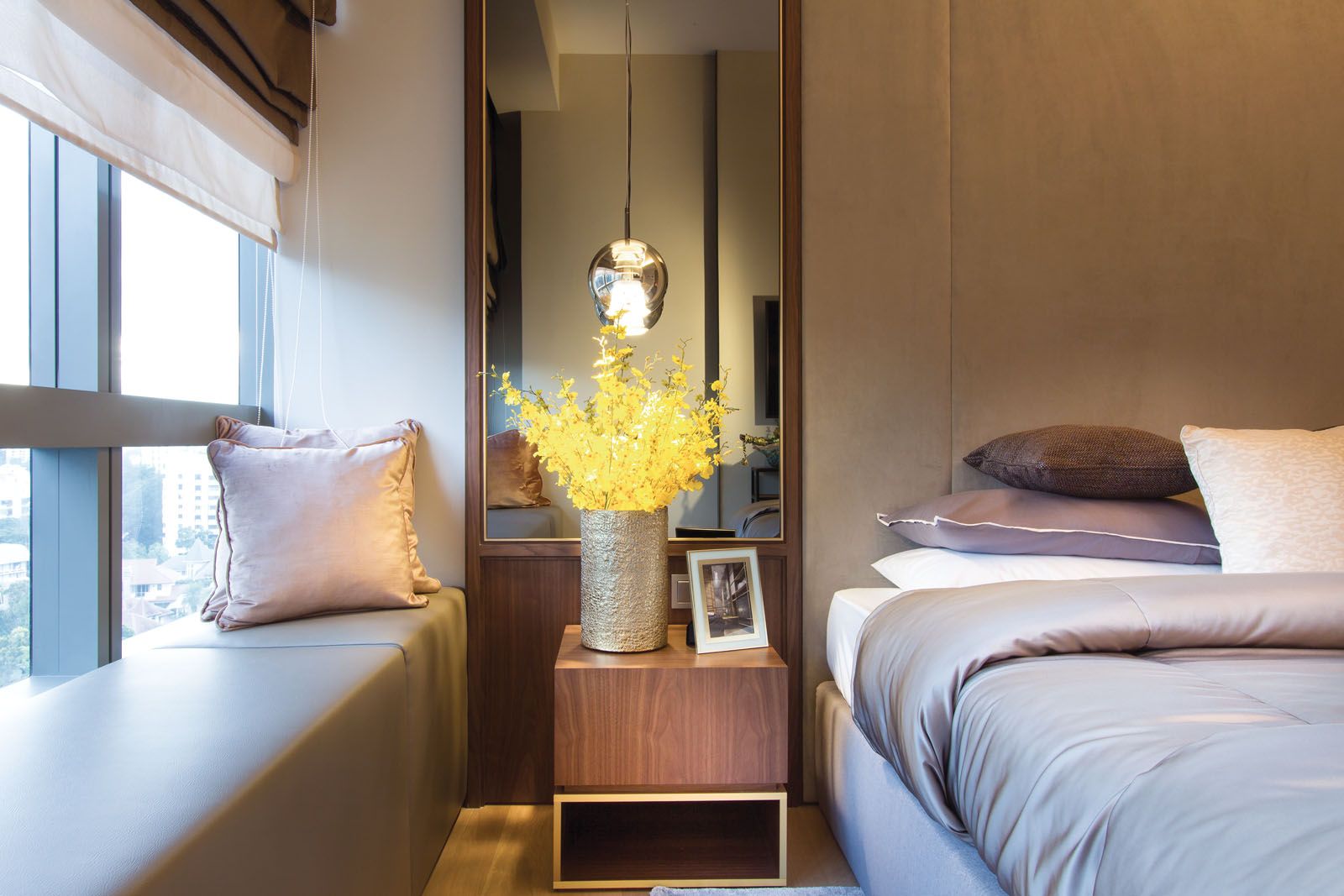 Lavender accents complement the elegant look of this guest bedroom