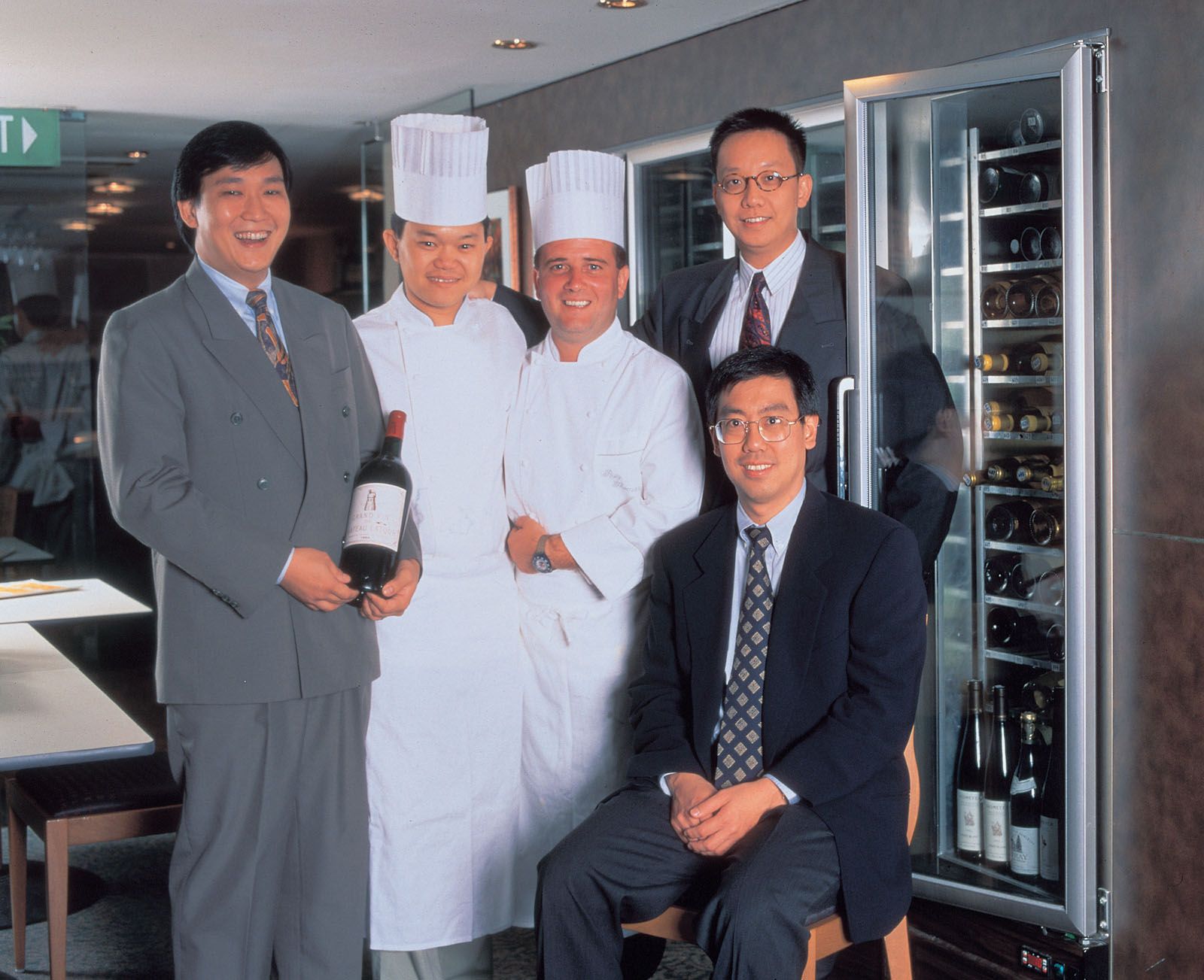 Les Amis Group founders (pictured from left) Ignatius Chan, Justin Quek, Chong Yap Seng and Desmond Lim (seated), with a former pastry chef