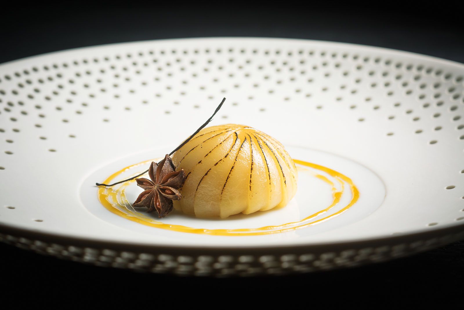 Williams pear poached in an infusion of star anise and bourbon vanilla, and paired with light vanilla cream