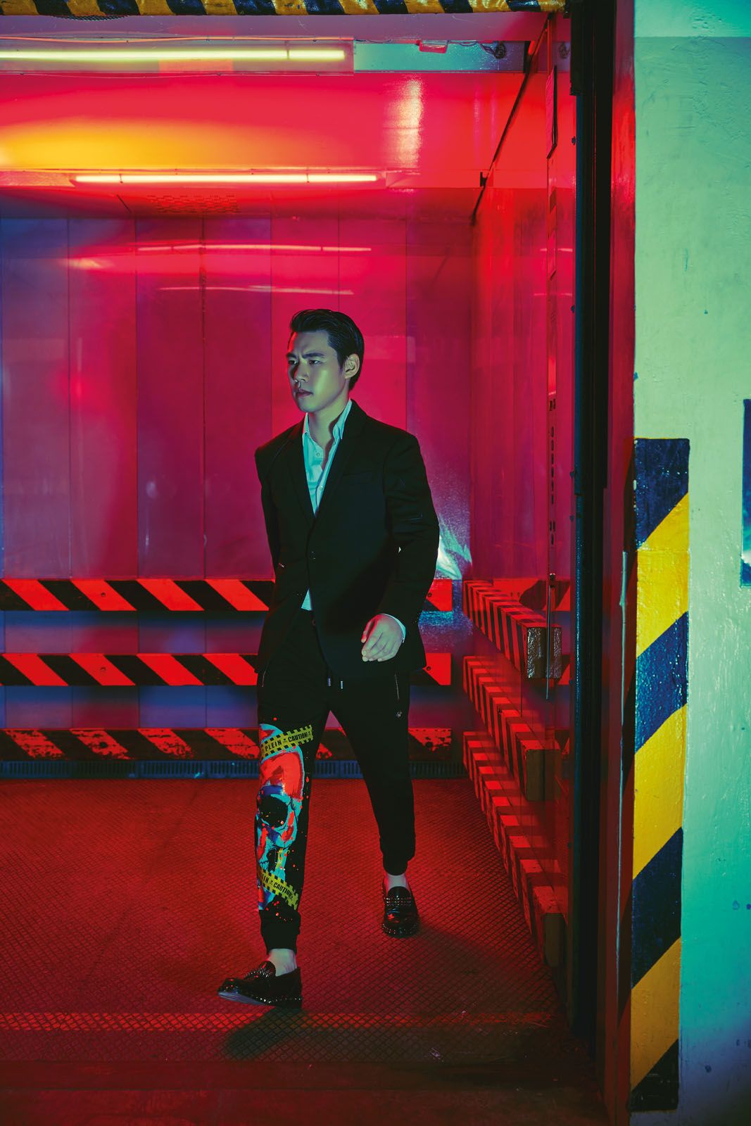 Ken wears wool blazer, cotton shirt, printed cotton joggers and studded leather moccasins