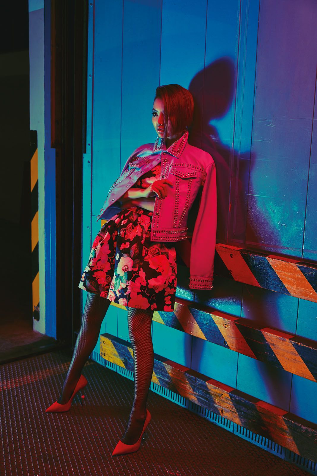 Rachel wears crystal-studded leather jacket, floral polyester-viscose blend dress and suede pumps