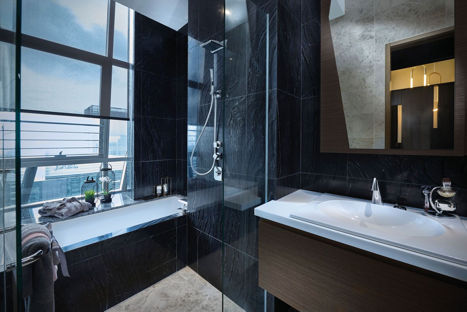 Each bathroom features a luxurious mix of natural stone and wood