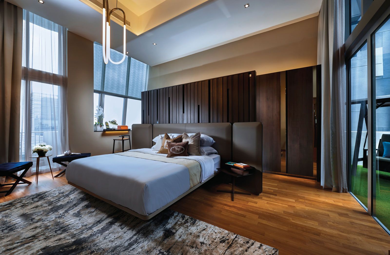 The earthy palette adds to the restful ambience of the master bedroom