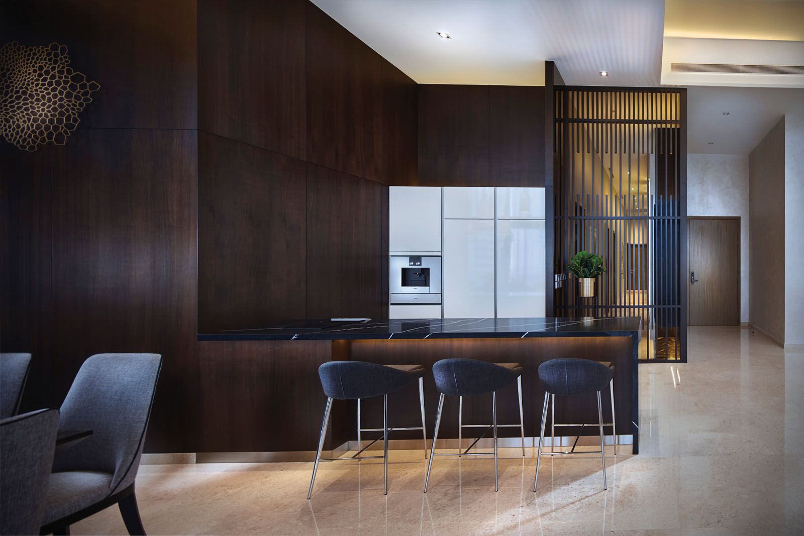 The wooden cabinetry adds to the cosy ambience of the culinary area