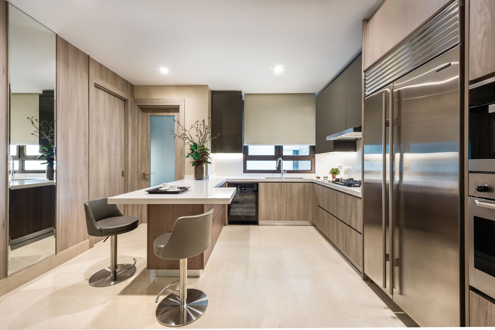 A bar counter at the minimalist kitchen is the family’s preferred spot for breakfast;