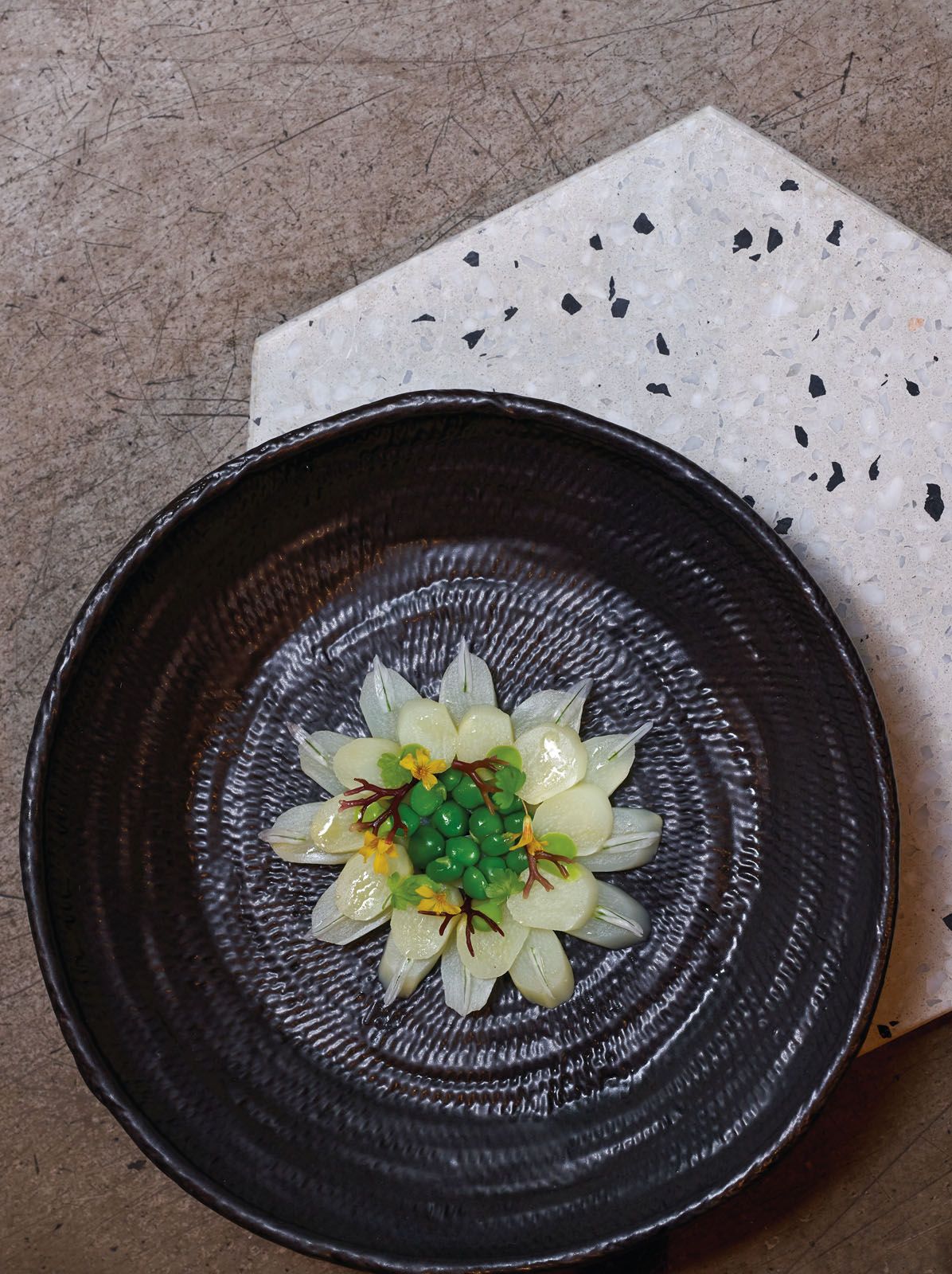 White asparagus by Seumas Smith, Maggie Joan’s. This seemingly simple celebration of the seasonal white asparagus is paired with French peas, seaweed and edible flowers and served with a lovage emulsion.