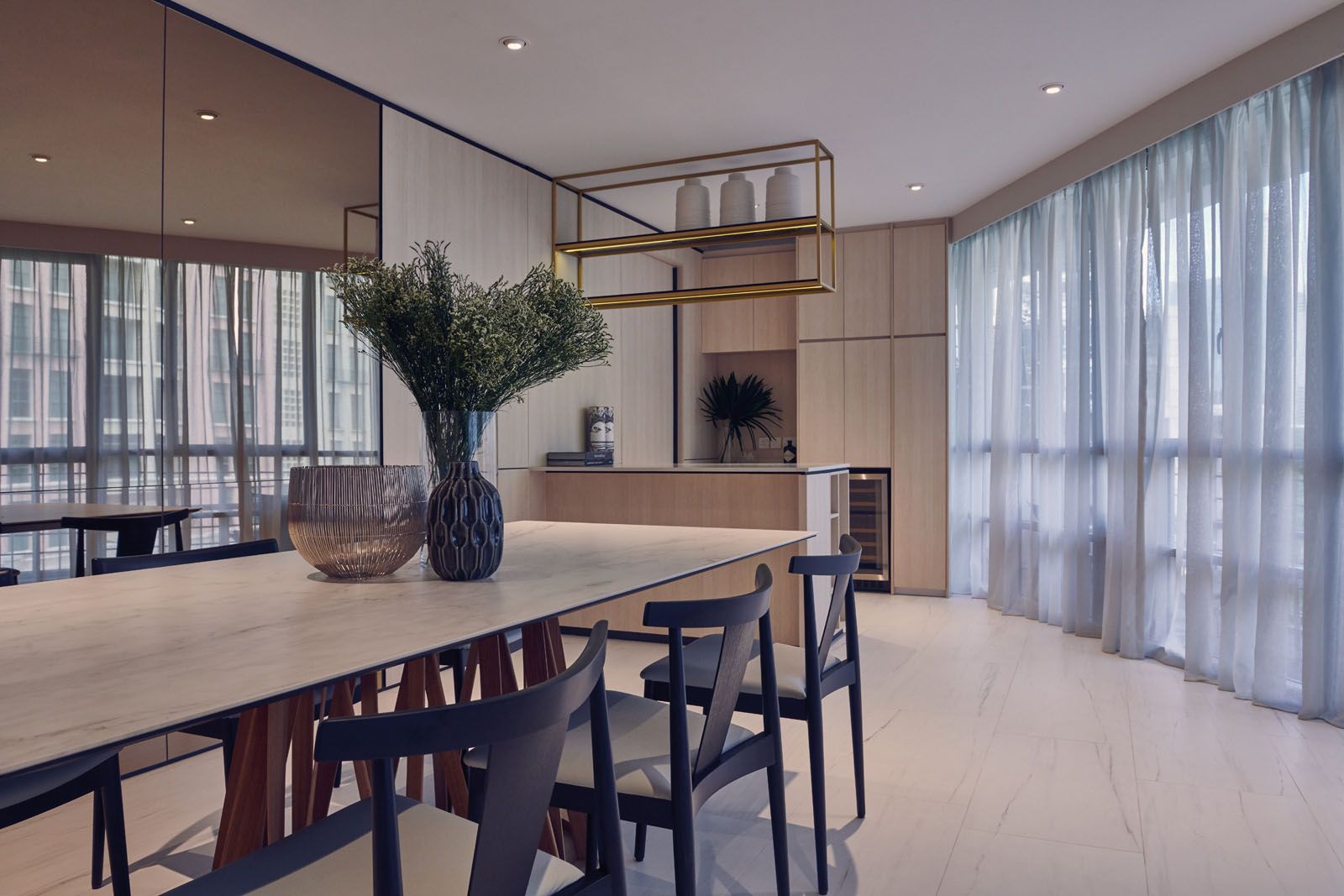 The mix of pale wood and beige floor tiles adds to the cosy ambience of the apartment