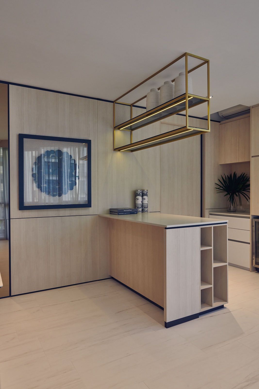 The display shelf features built-in lighting that casts a gentle glow in the dry kitchen