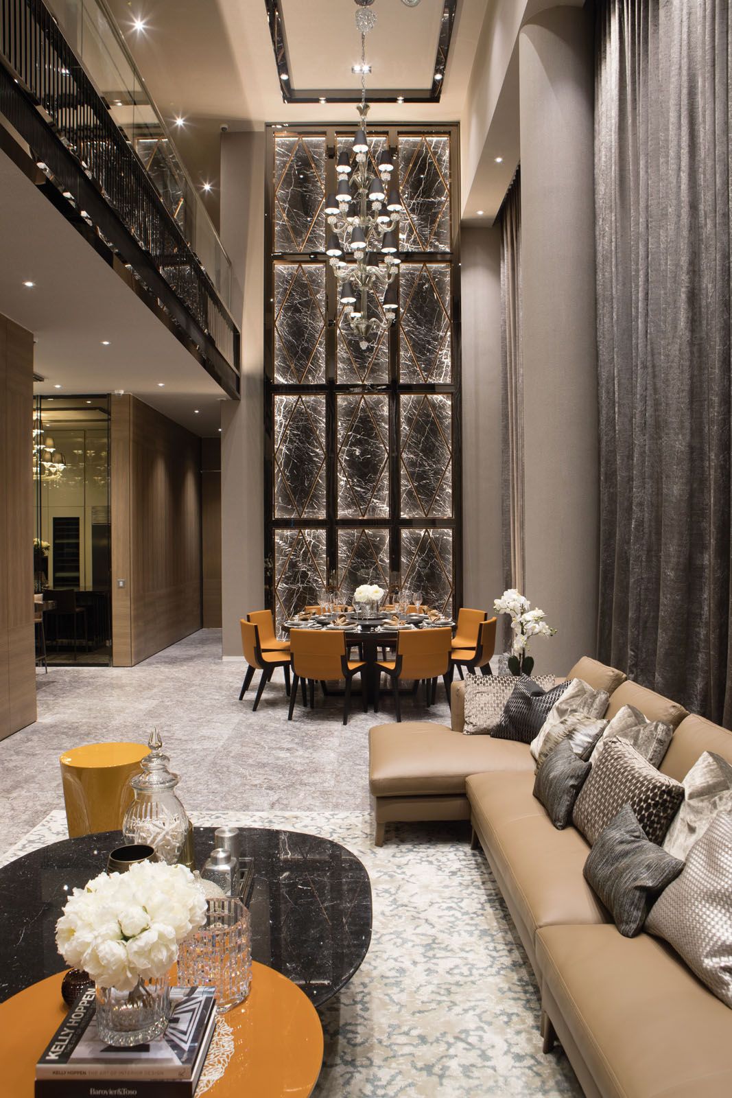 Built-in lighting draws attention to beautiful veins of the marble feature wall