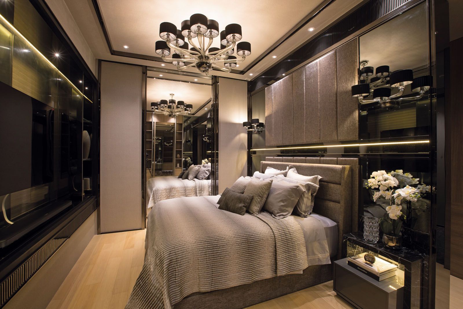 The master bedroom features a full-height mirror that can be concealed behind a pair of sliding doors