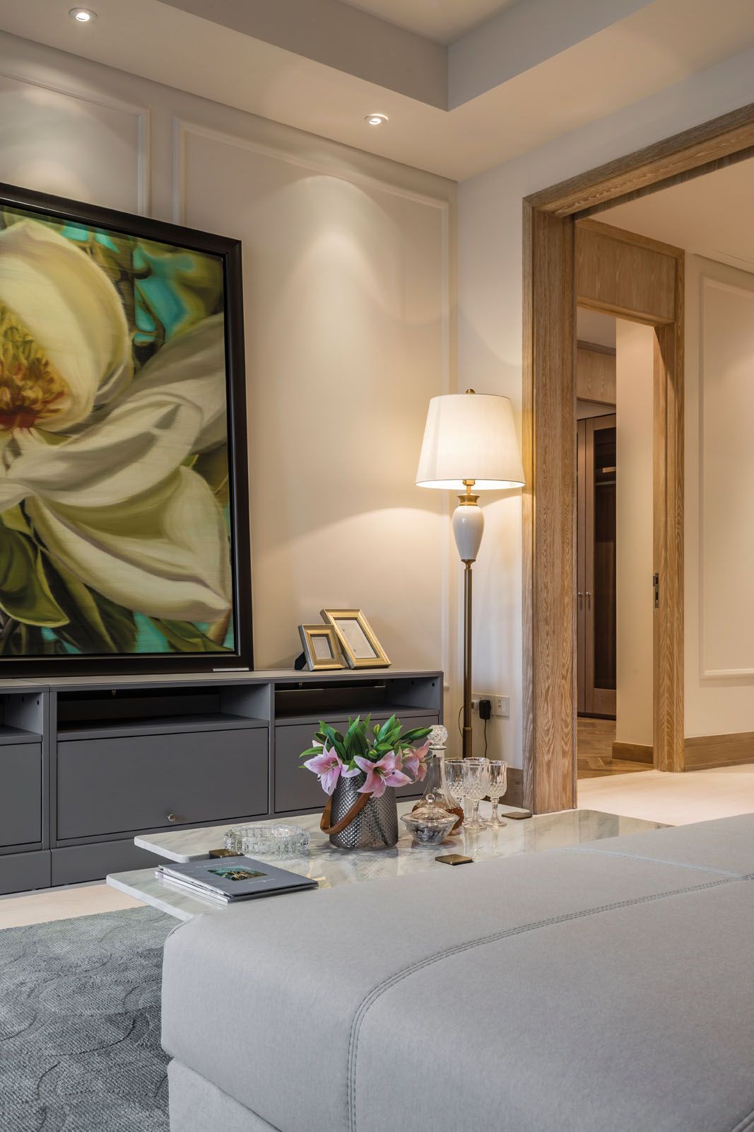 A floral artwork is the focal point of this lounge area