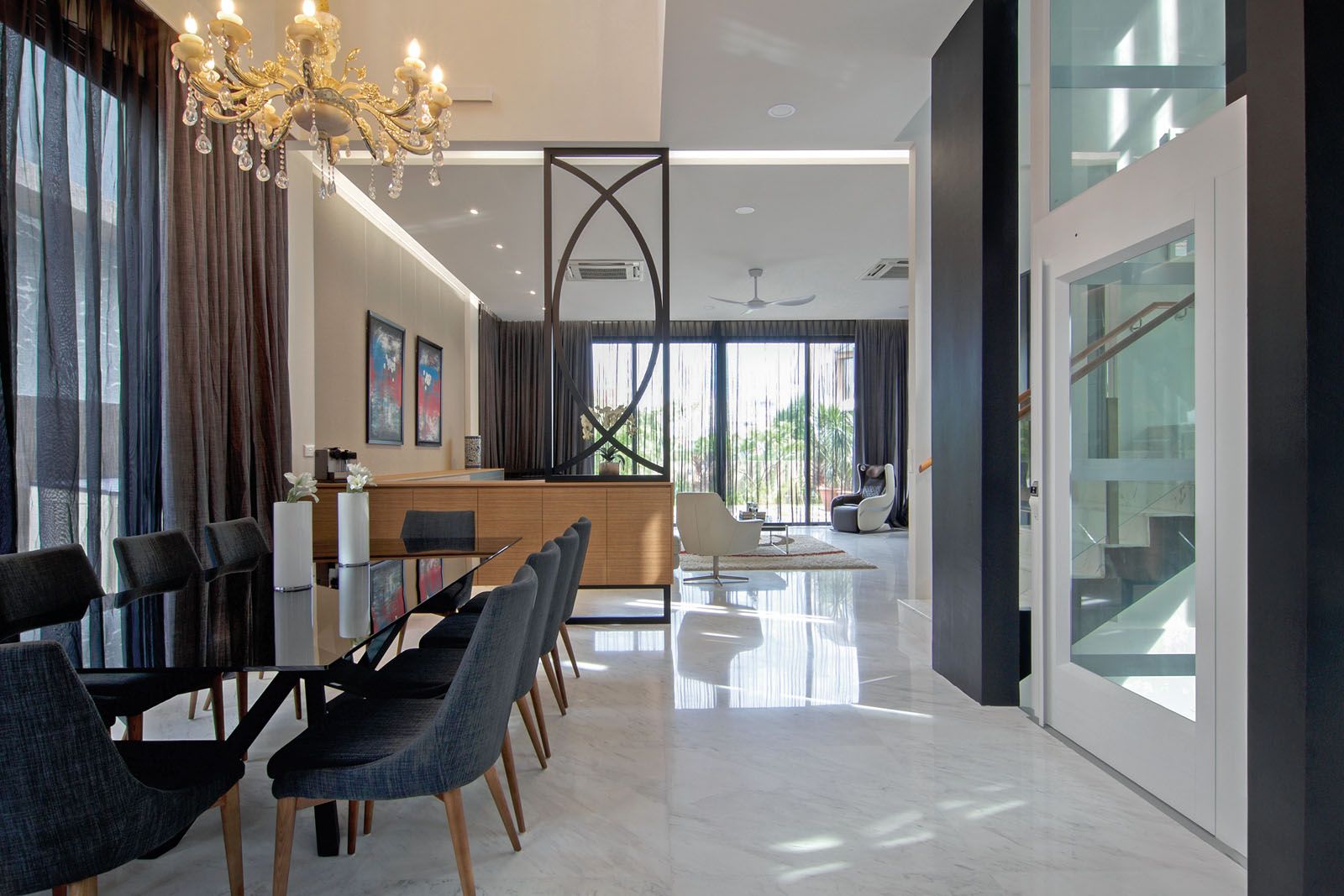 The glamorous chandelier is the focal point of the dining area