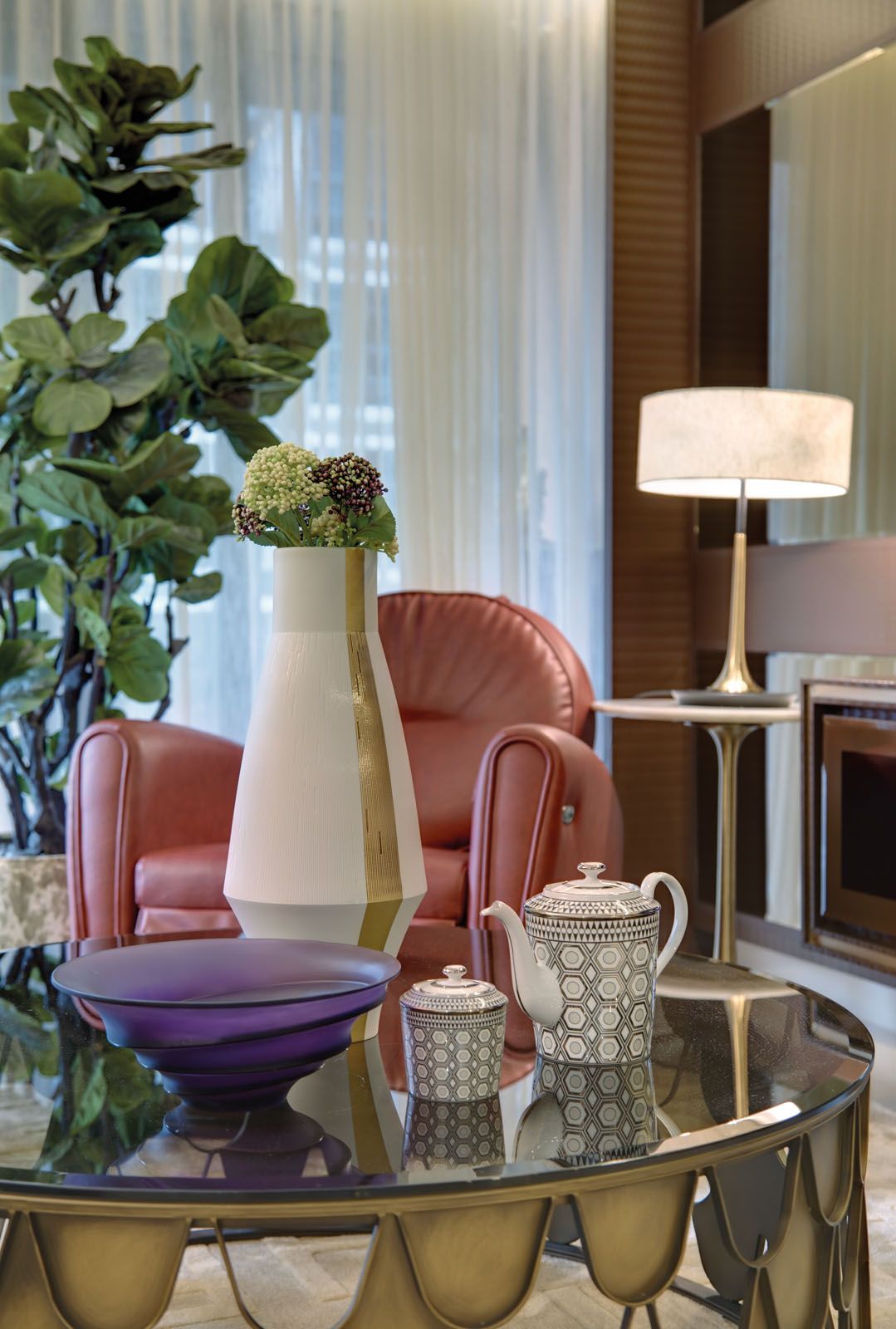 A purple Daum bowl and the rouge Osim massage chair add pops of colour to the space