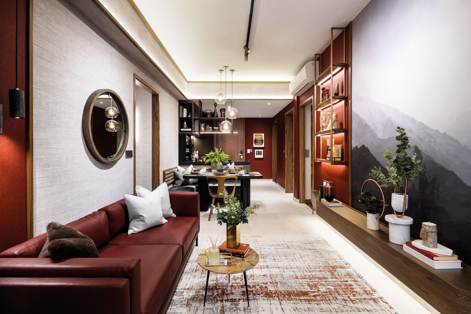 The mountainous scene imbues a sense of calm to the glamorous living area