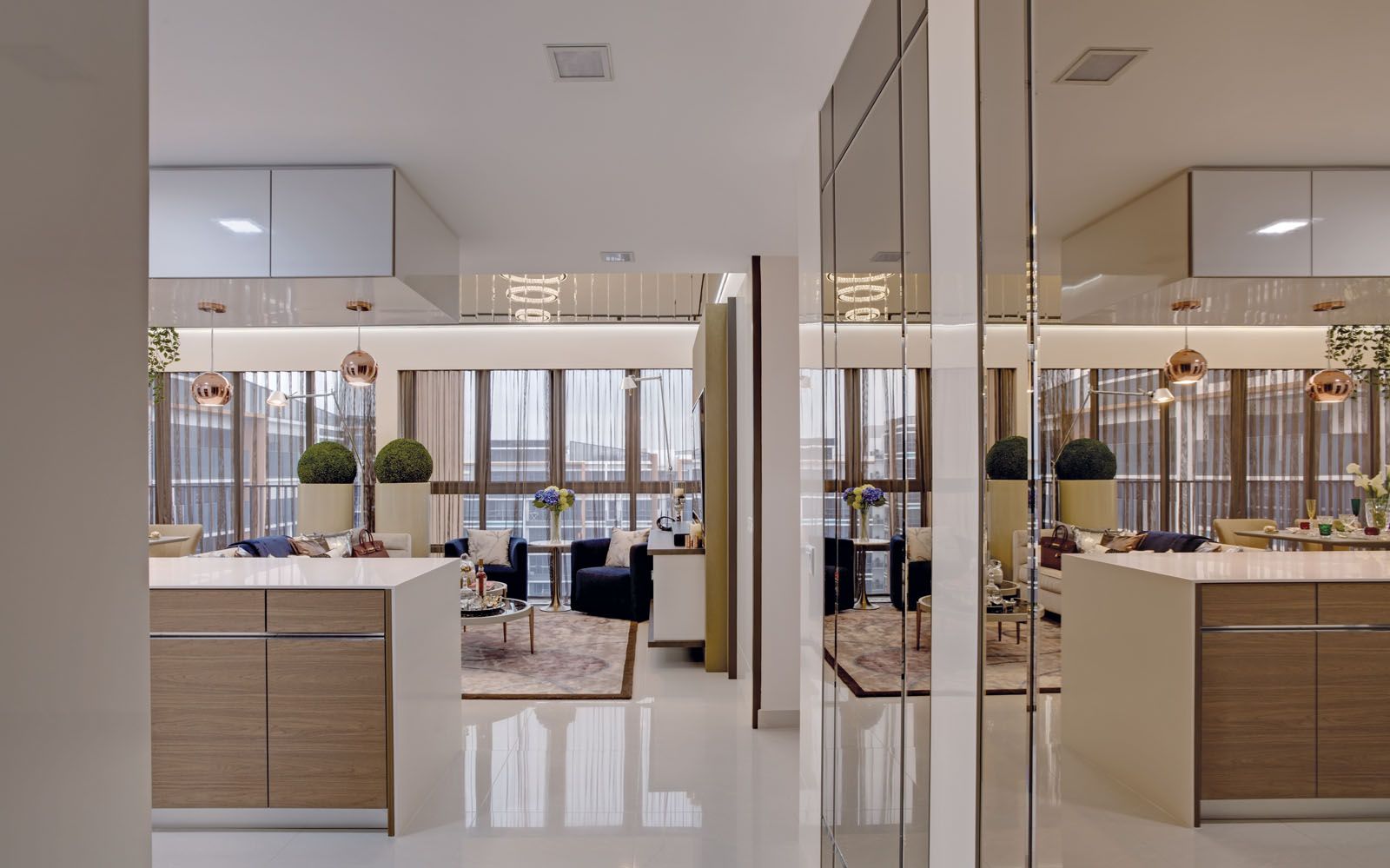 Bronze mirrored panels add to the sense of space in the living and dining areas