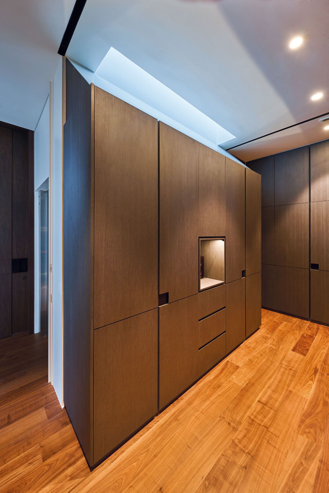 The skylight brightens up the wardrobe area of the master bedroom